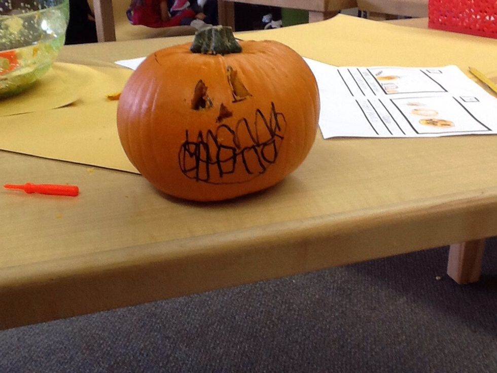 Then, put the light in the pumpkin.