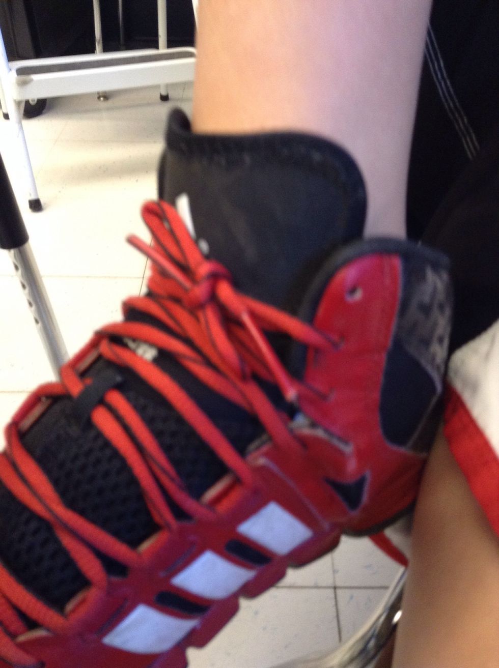 Then put the one bunny ear in the hole and make a knot.