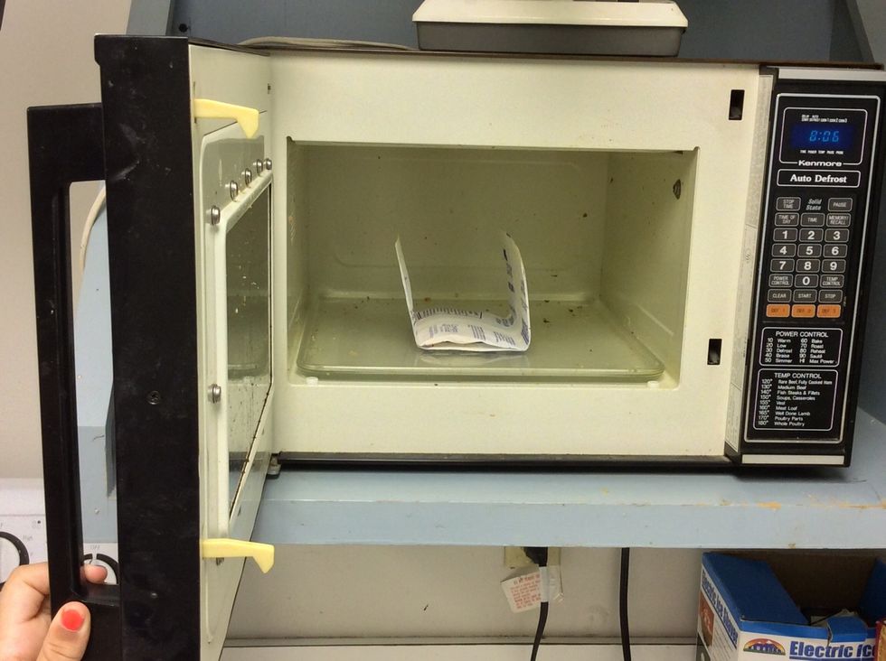 Then put the popcorn in the microwave.