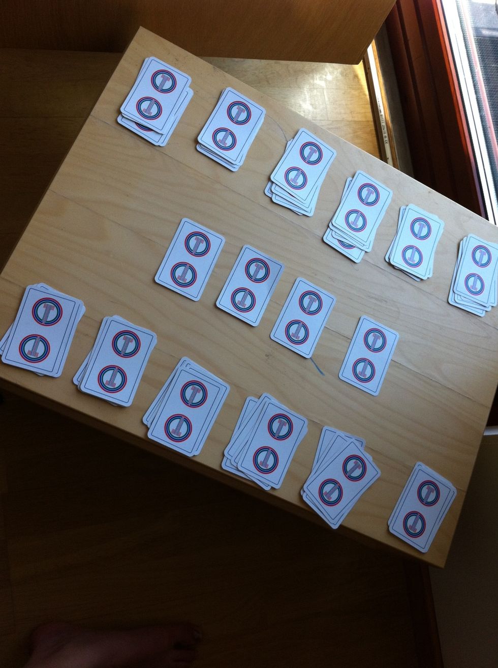 Then put the remaining four cards in the middle. If it is not even, you counted wrong or you are missing some cards.