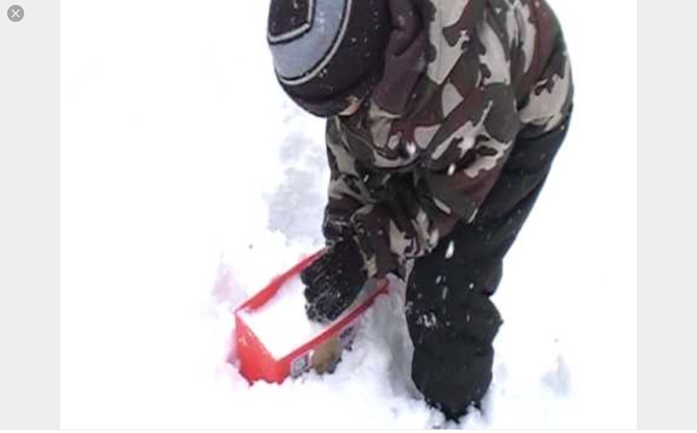 Then, put the snow into the snow  brick maker.