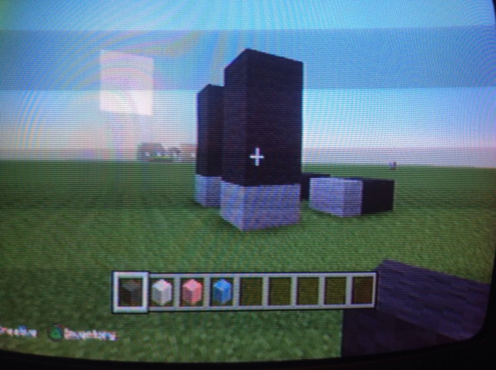 Then put three gray blocks up on all sides .