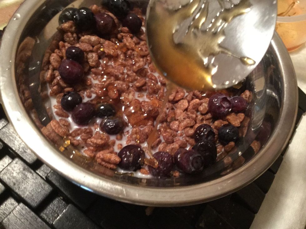 Then put three tablespoons of honey into the bowl however going a round in clockwise. If there is too much honey sticking on the spoon then you could use chopsticks to get the honey off the spoon.