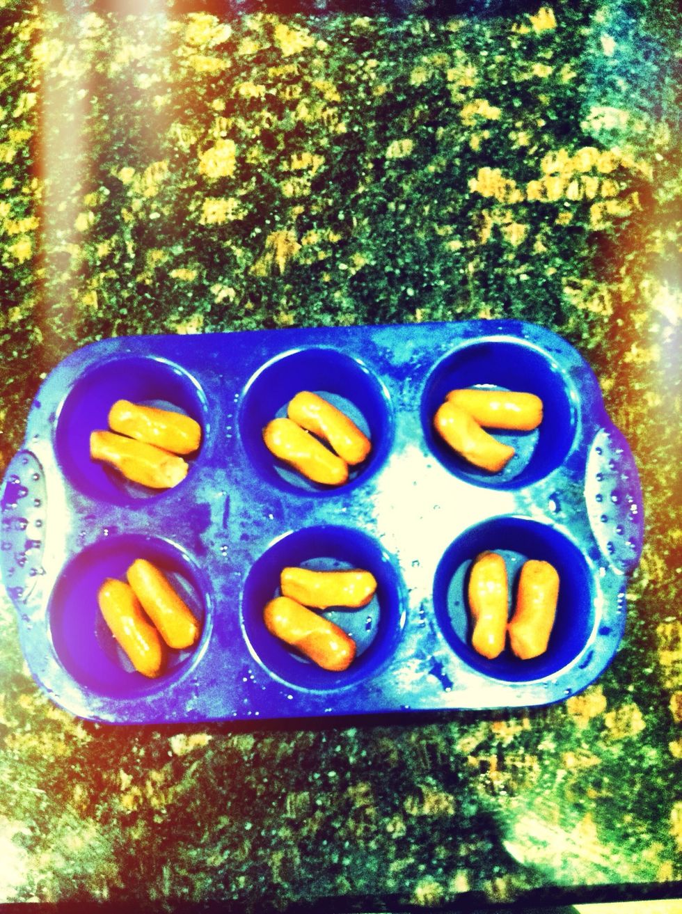 Then put two smokies per muffin cup..