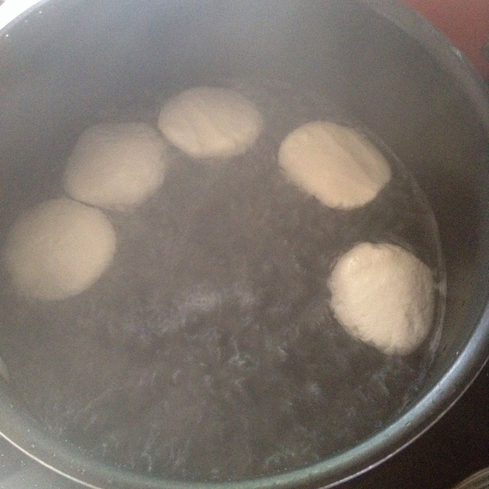 Then put your balls right into the water and close lid for 4 mins flip them Then cook for another 4 mins remove them from water and while your other milk is still thickening put them in that milk