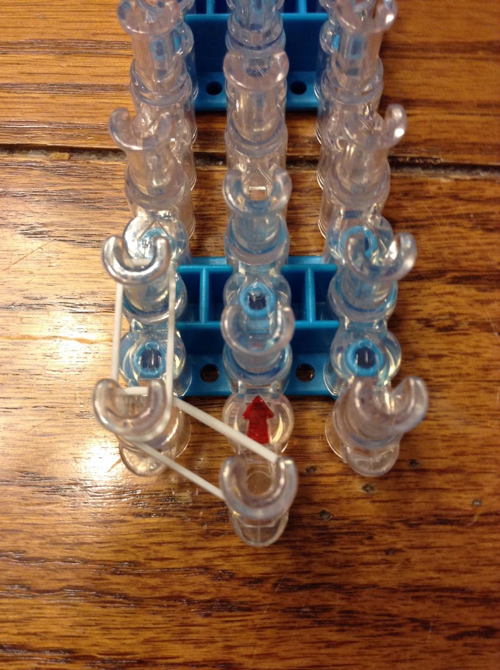 Then put your next band straight up and then a third band up diagonally to the right.