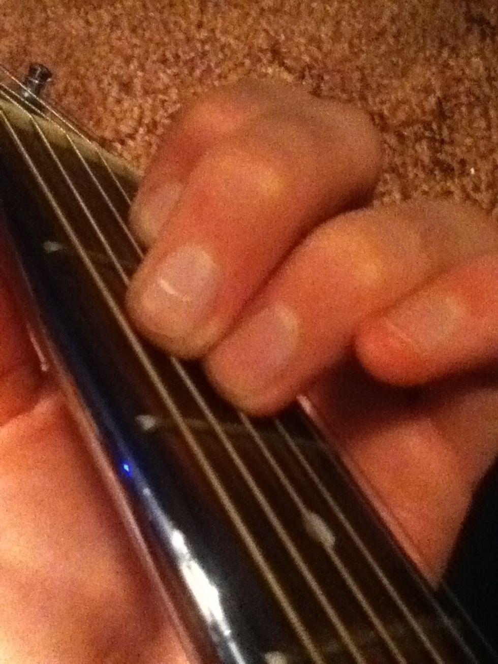 Then put your ring finger on the 2nd fret, 4th string. Then put your middle finger right above that.