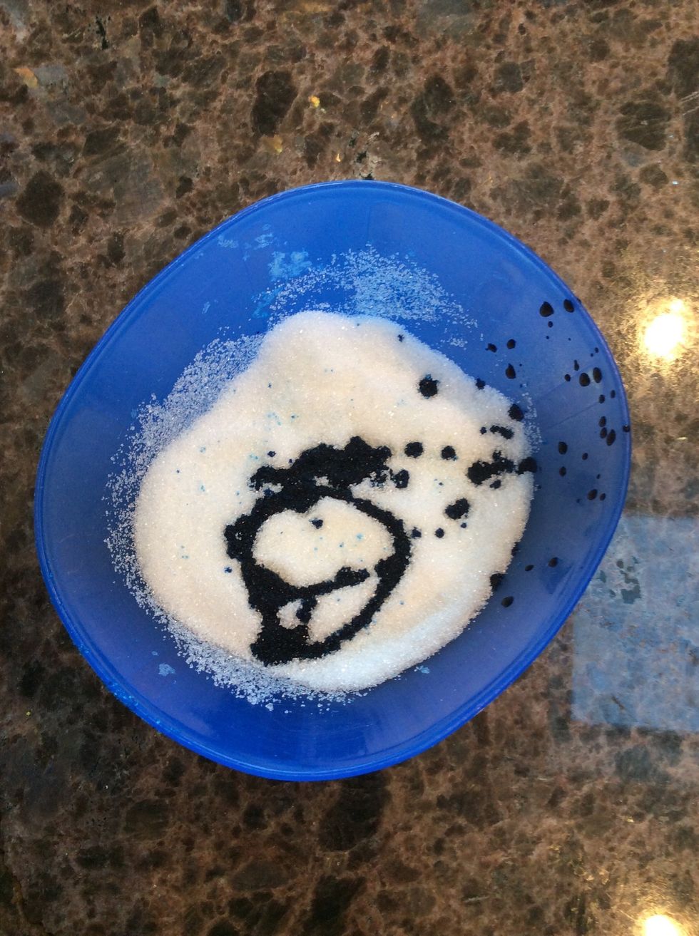 Then put your sugar and food coloring in a bowl, I chose to use neon blue food coloring! (Make sure there are no clumps in the sugar)