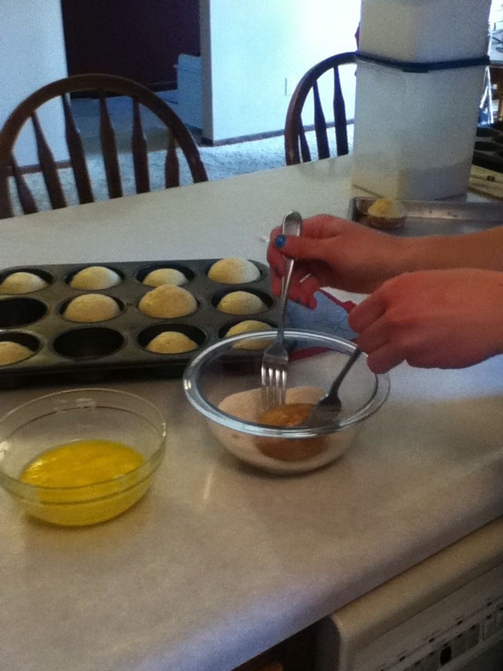 Then quickly put the muffin into the sugar and cinnamon mix. Complete cover the butter area with the sugar also. Then let cool and enjoy!!
