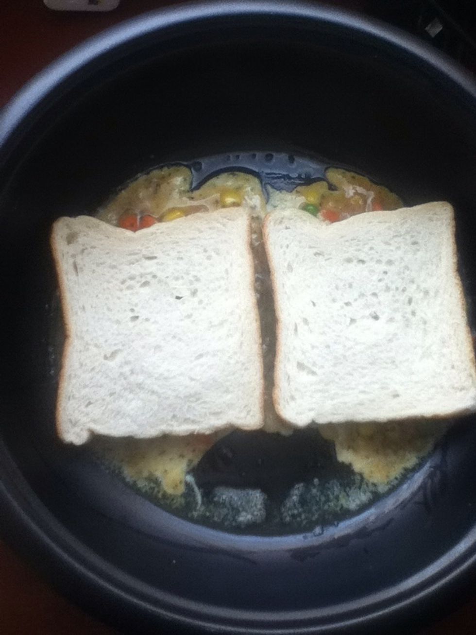 Then quickly take a piece of bread and placed them on top. Make sure you press them a little bit so that the good stuff will stick nicely..
