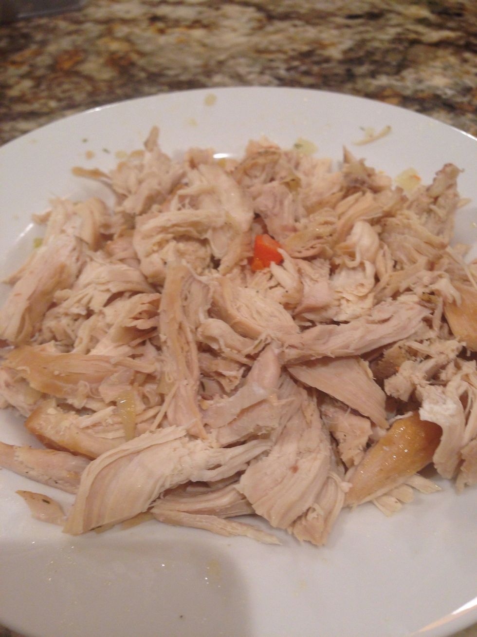 Then, remove the chicken and allow to cool enough to handle.    If you're impatient like me, remove the skin and use two forks to pull the chicken.  \ud83d\ude2c