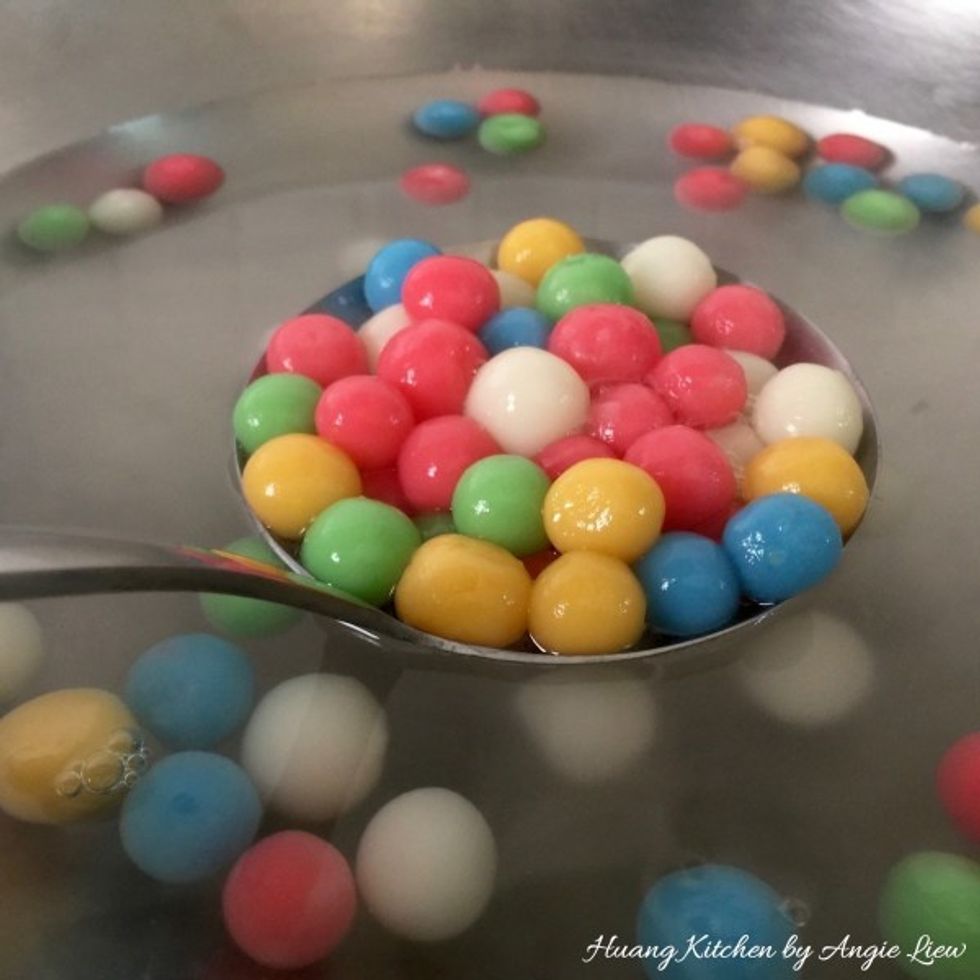 Then, remove the cooked rice balls with a perforated ladle.