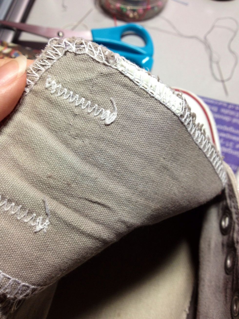 Then remove the product label attached to the shoe, or sew it onto the shoe flap so that it doesn't get into your way while sewing. My shoes were pretty old so I could just rip the product label away.