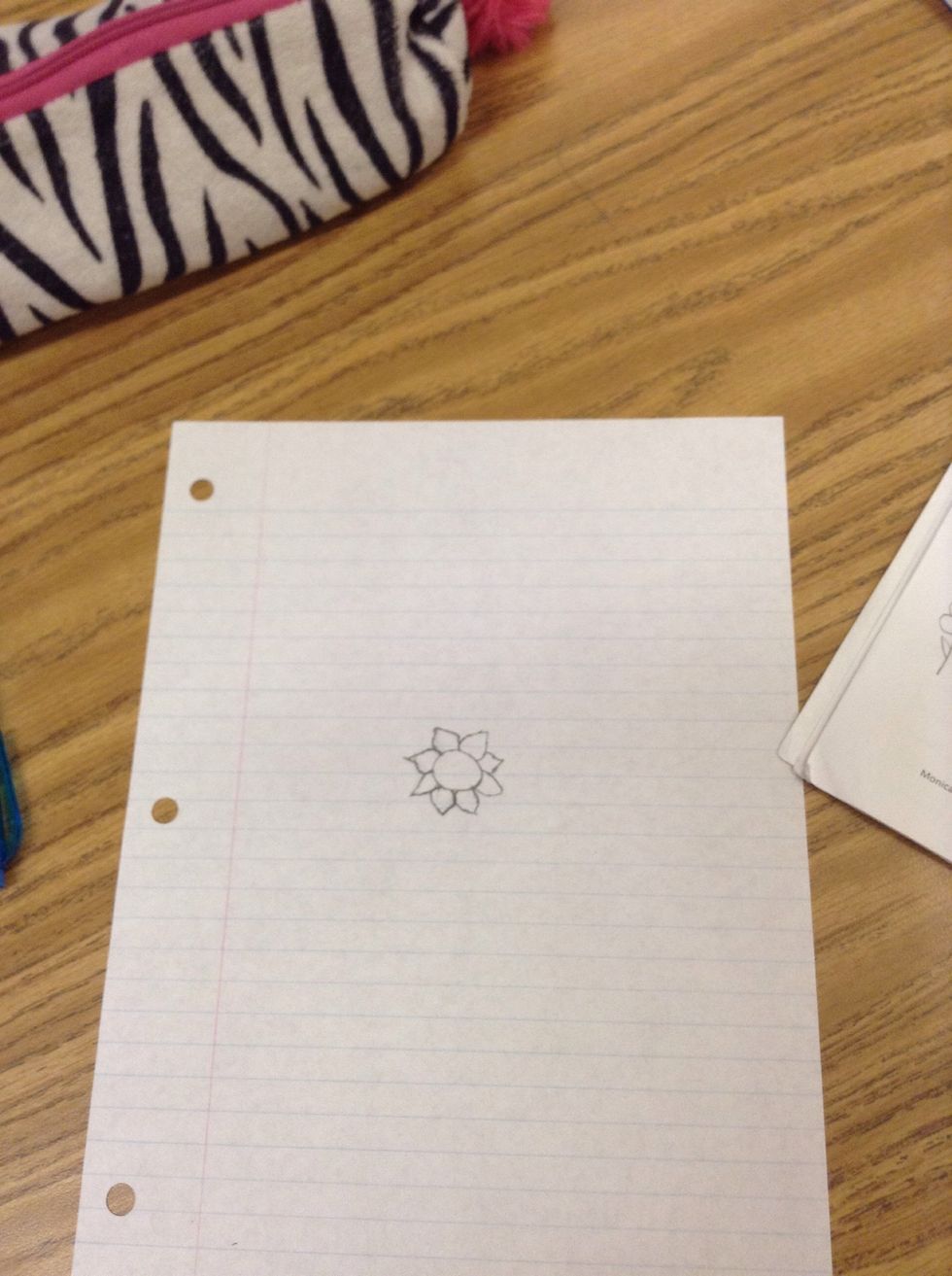 Then repeat until there are petal shapes around the circle.