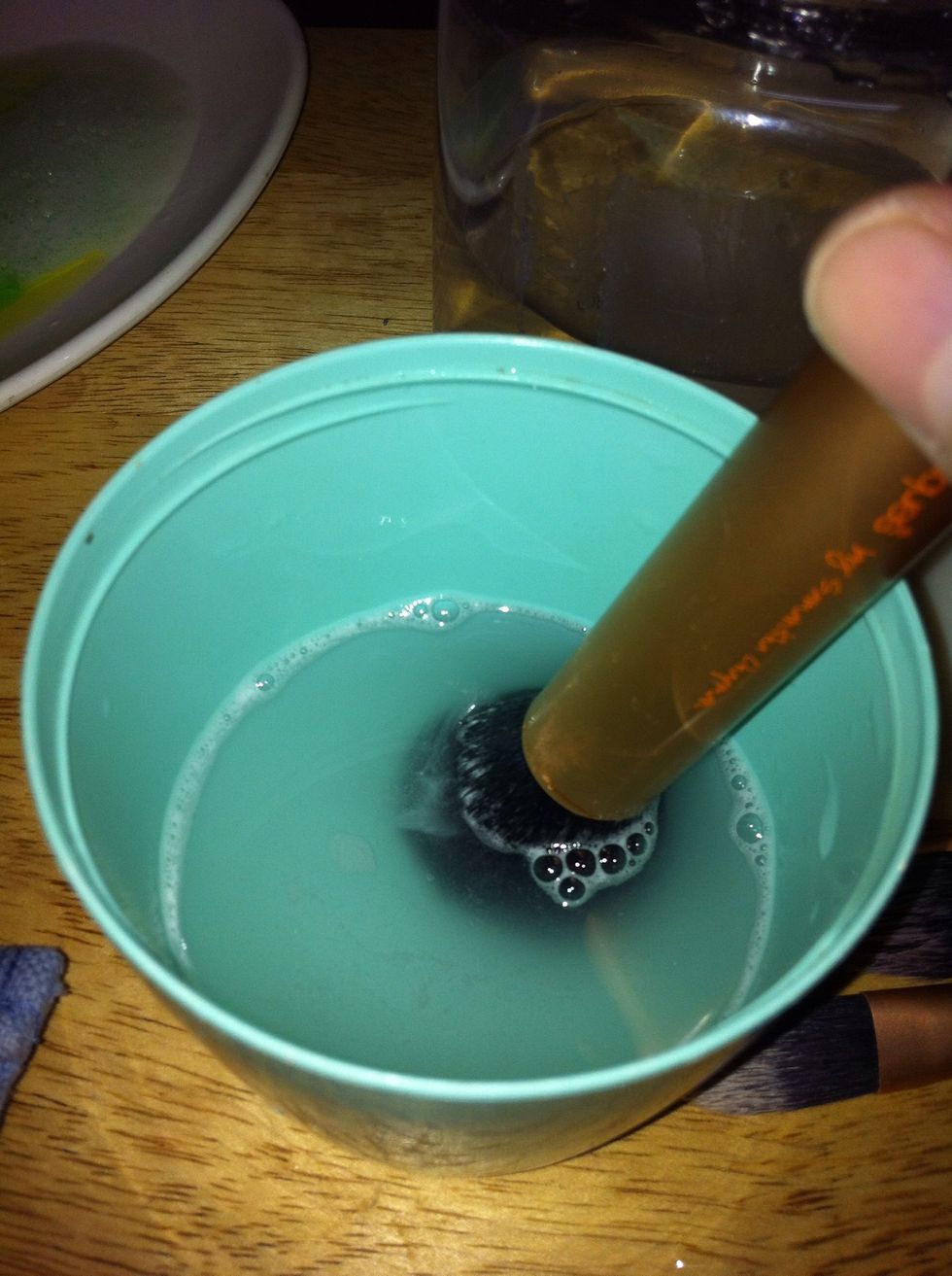 Then, rinse the brush in warm water. Again, swirl, swirl, swirl!