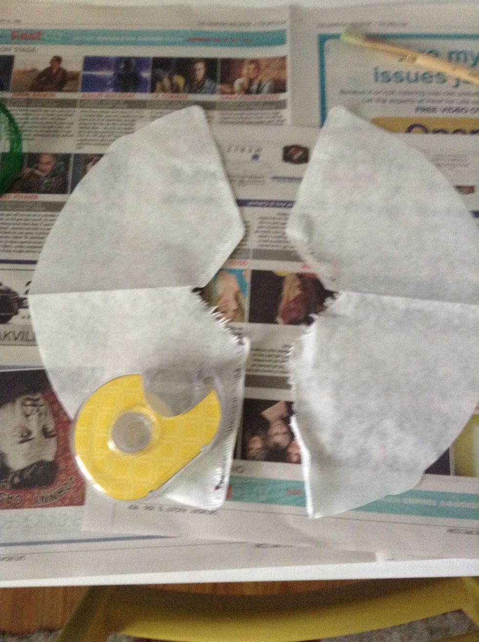 Then, rip the two coffee filters along the side and tape them together to make one oval shape.
