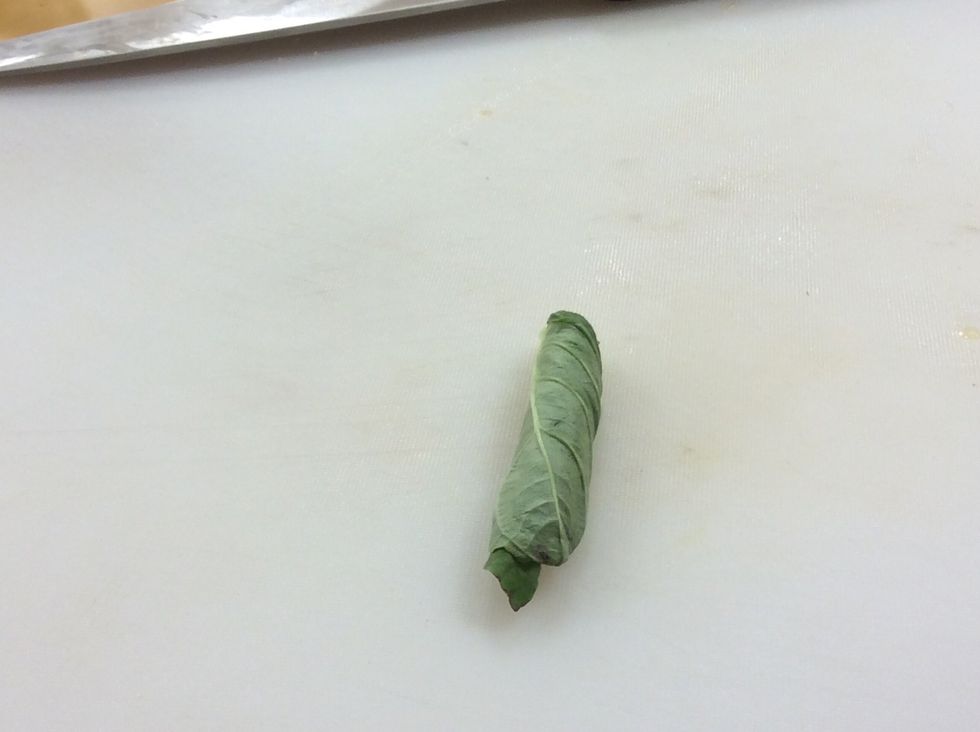 Then roll the stack of leaves up as tight as you can.