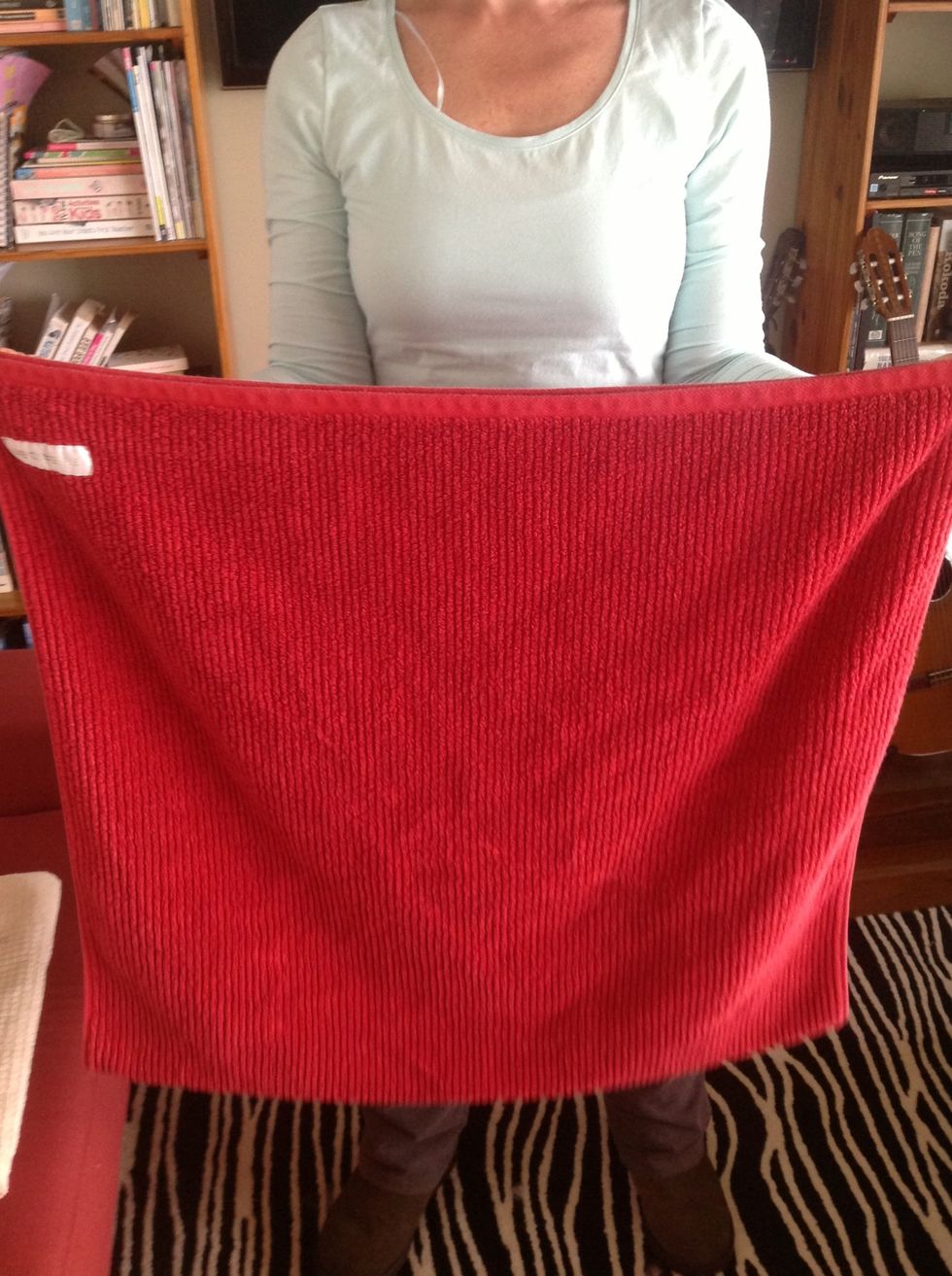 Then rotate until either the open end or the fold is facing you.