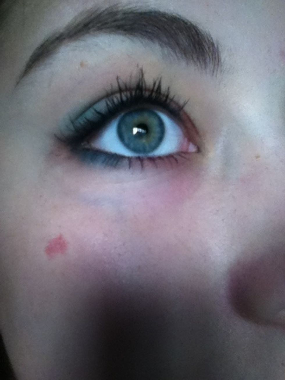 Then roughly line 1/2 of of your bottom lid with the bright blue eyeshadow.