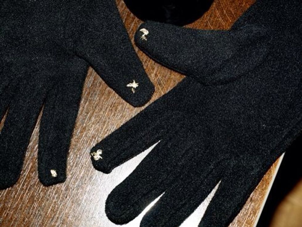 Then sew some into the finger tips and/or thumbs of your gloves. Remember it has to be at least 1/4" wide. You can make it look better than this by doing a little weaving style sewing.