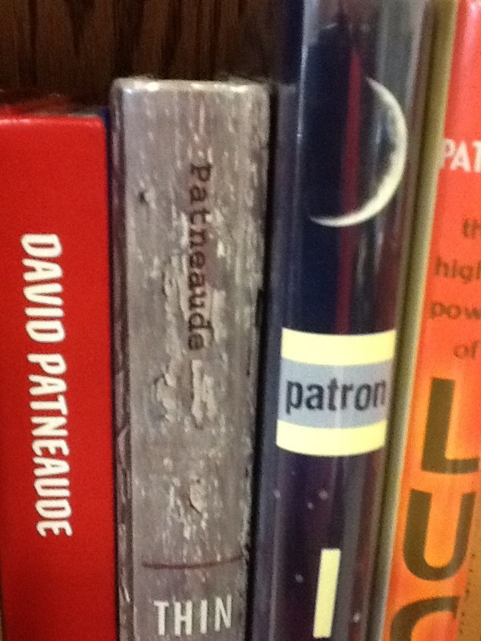 ...then shelve alphabetically by the full authors' last names because the white label is only the first three letters of their last names.