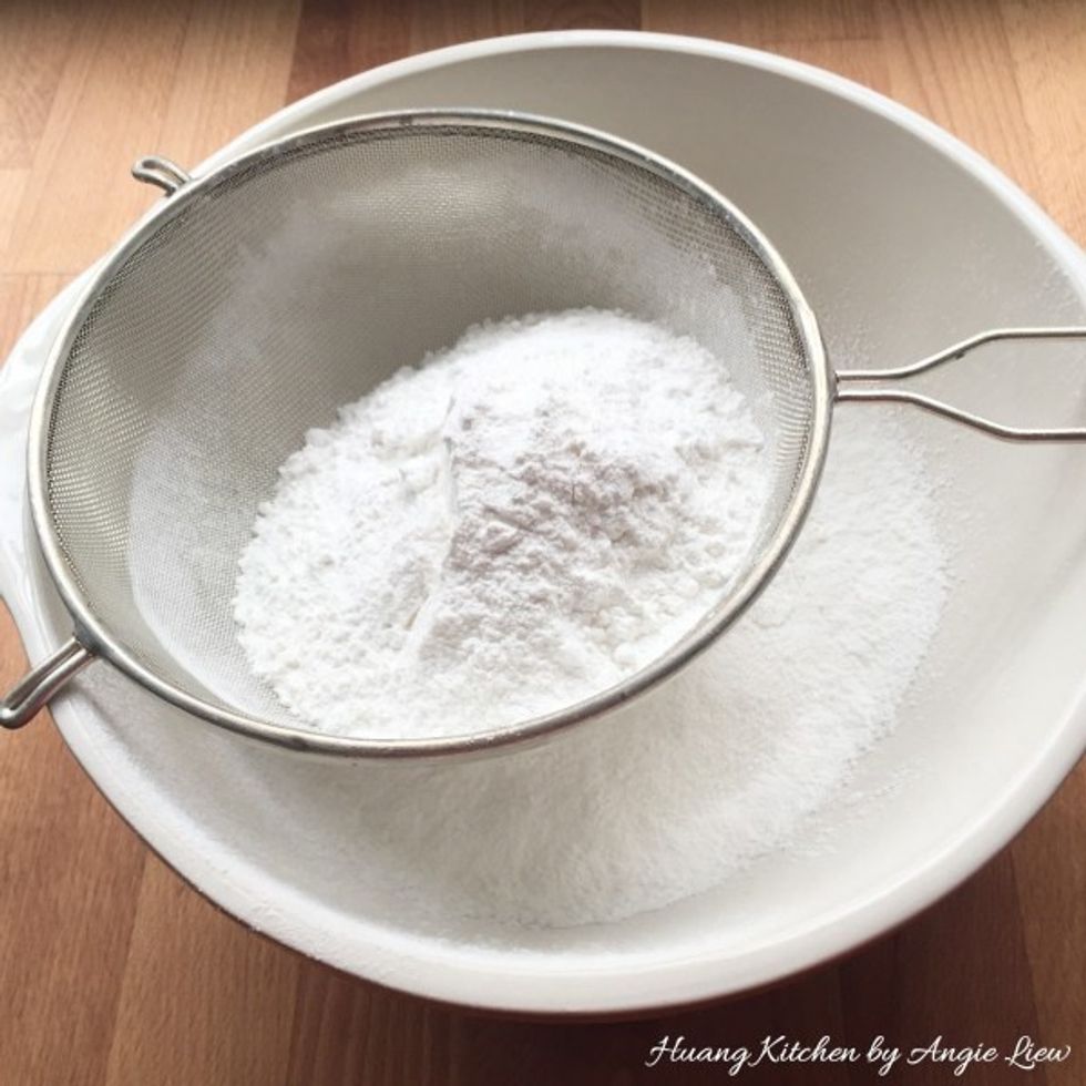 Then, sieve glutinous rice flour into a large mixing bowl.