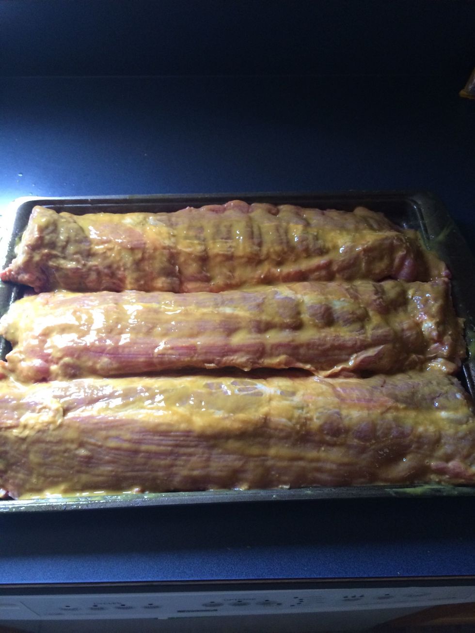 Then slather the tops of the ribs...