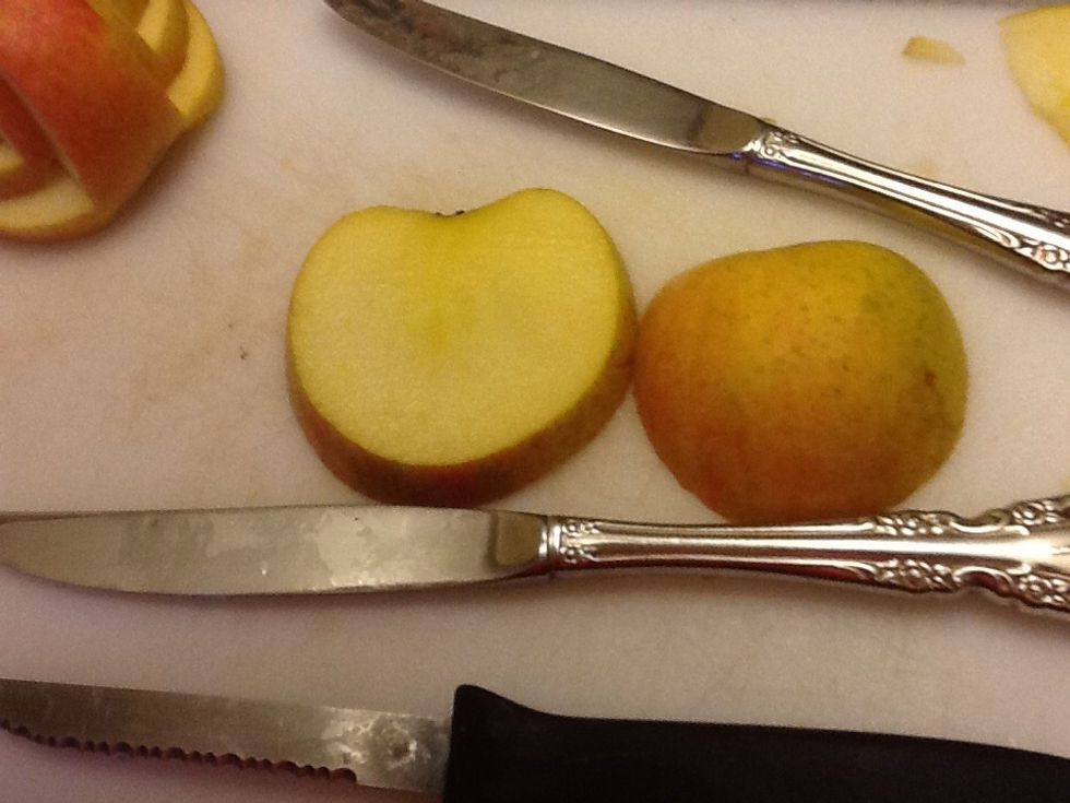 Then slice the other half of the apple until you get a piece that looks like a flattened heart