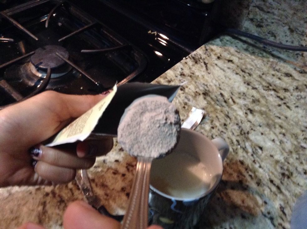 Then slide all of the powder off the spoon and put it in the mug