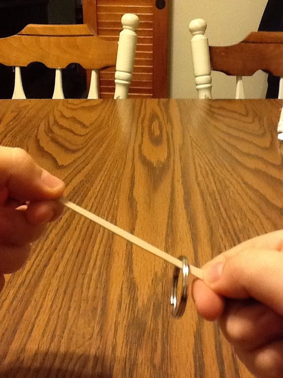 Then slide the ring down to the bottom of the rubber band