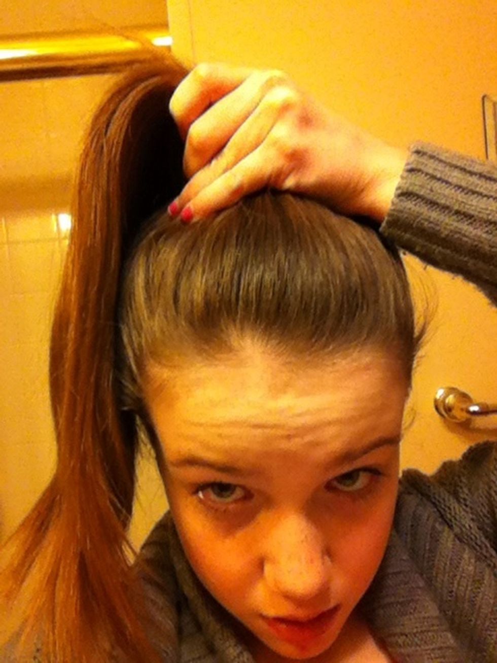 Then slightly pull your hair up to the top of your head