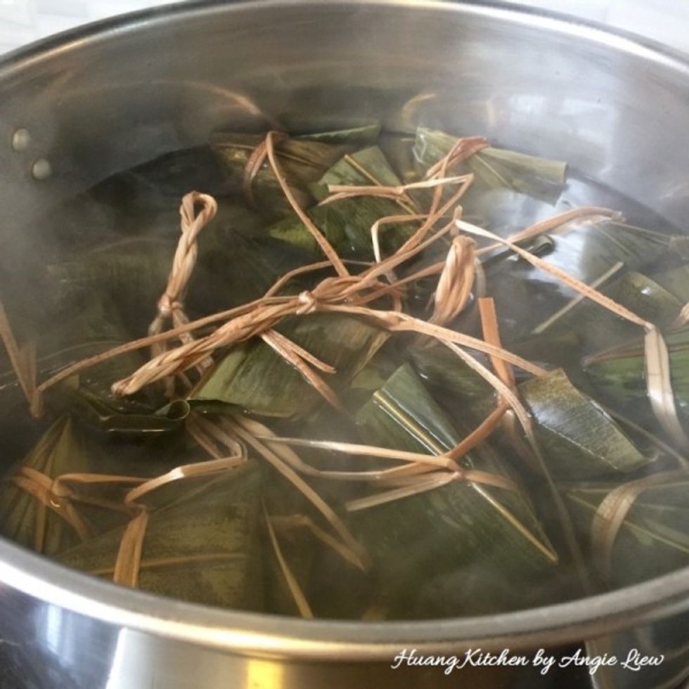 Then slowly place the dumplings into the water, making sure they are fully submerged. Cover and cook slowly over medium heat for about 2 hours, depending on size.