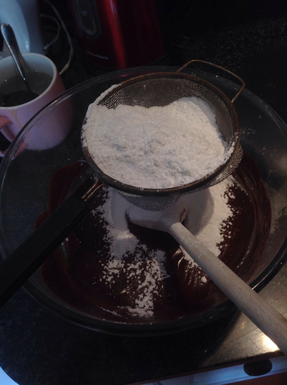 Then slowly sieve in the icing sugar and mix with beaters, it does seem like a lot at first but it will disappear into the chocolate!