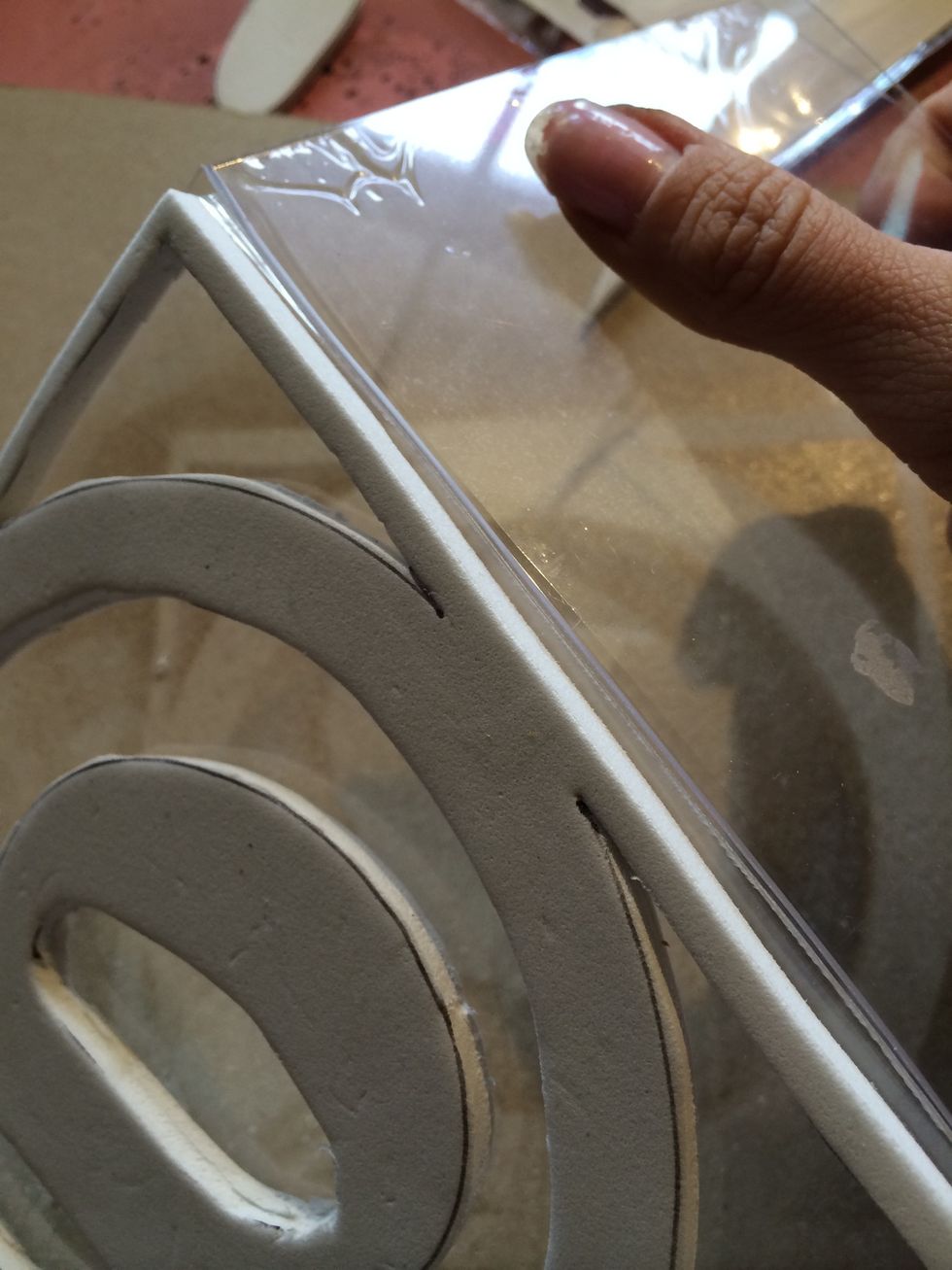 Then snap the acrylic. Repeat this on all sides as necessary.