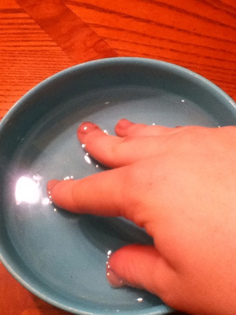 Then, soak your nails is warm water to wash off the extra acetone.