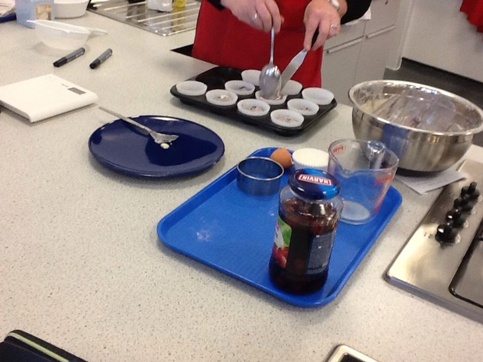 Then spoon the mixture into the the cup cake cases