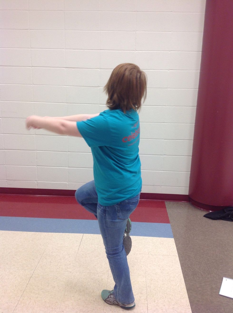 Then spot to the back letting your body follow, making sure you keep your core muscles tight.