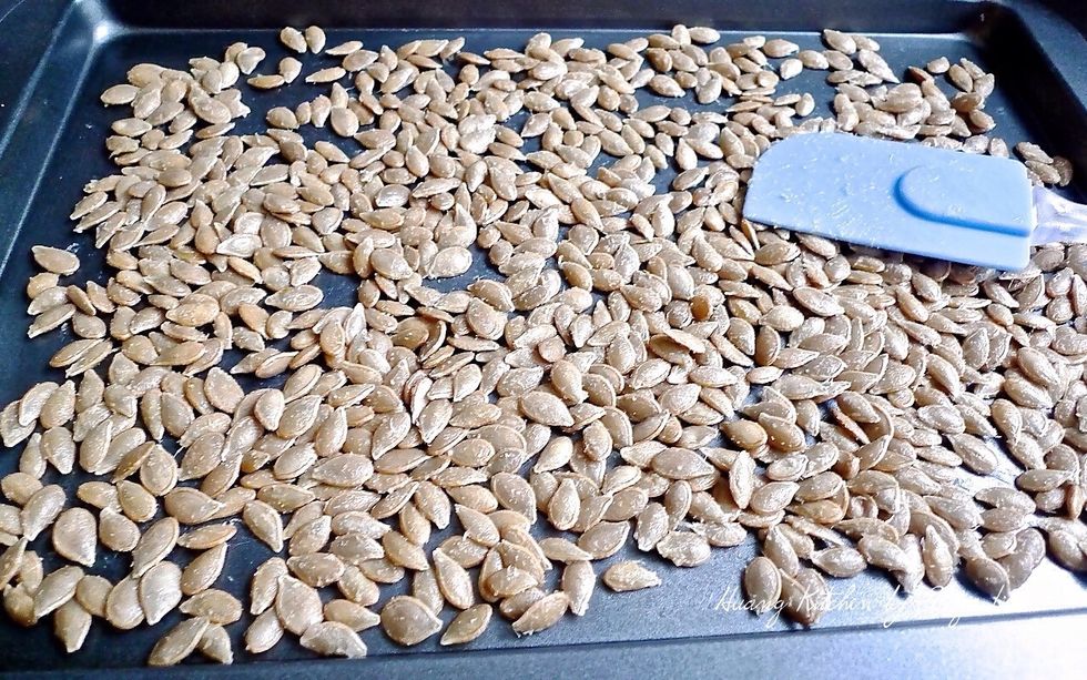 Then spread the pumpkin seeds out on a baking sheet in a single layer.
