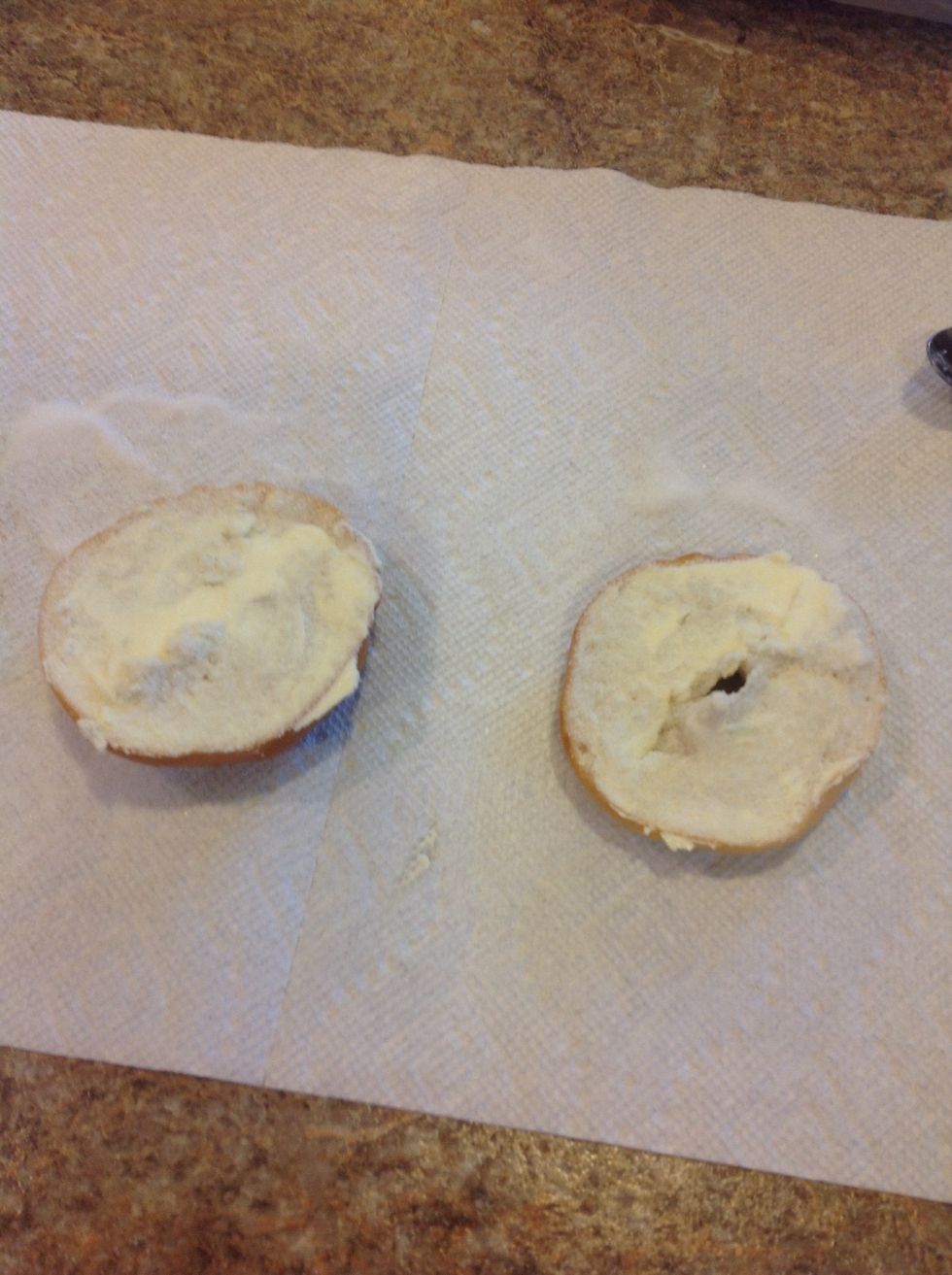 Then, sprinkle some sugar on top of your bagel.