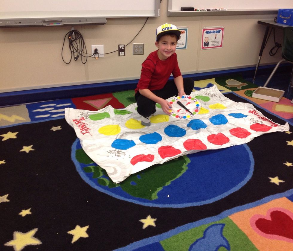 Then, stand on the mat with the spinner.