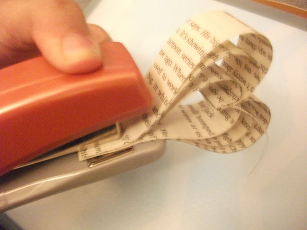 Then staple the bottom together, making sure all the strips are there. I would staple 1/2 - 1 cm up, so it is sturdier and retains it's shape for longer.