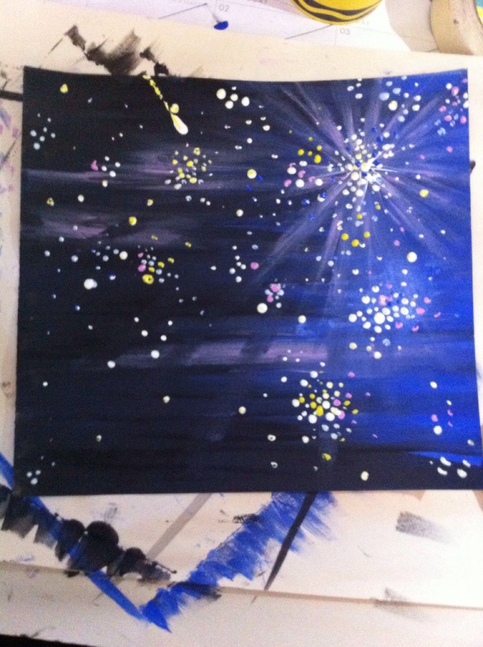 Then start adding dots! We will use acrylic paint and toothpicks to make the dots.