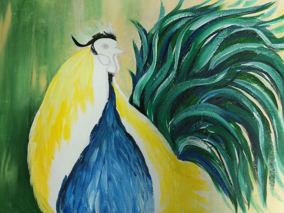 Then start adding yellow using the same type of brush strokes as you did with the blue chest.