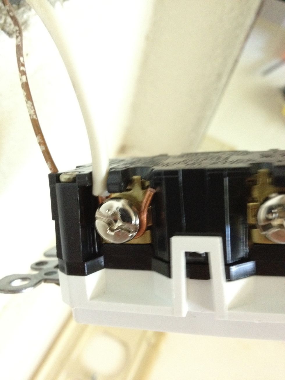 Then start attaching your white wires. If you look in the J-box you'll notice that the wires come together in pairs - a black and a white together and another black and white together.