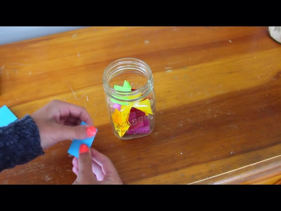 Then start folding the papers and putting then into your jar