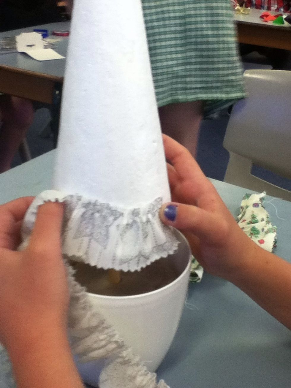 Then start glueing on the frist piece of fabric .