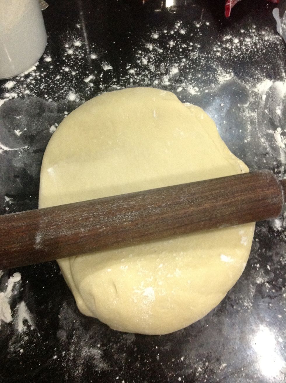 Then start rolling it out, using a floured rolling pin.