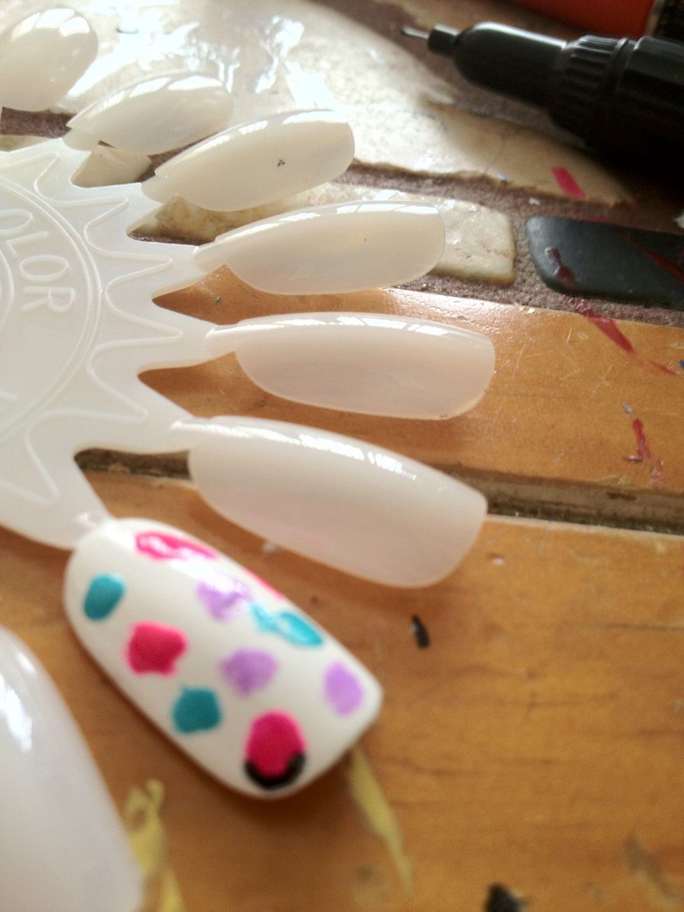 Then start to add black around the edges of the dots.