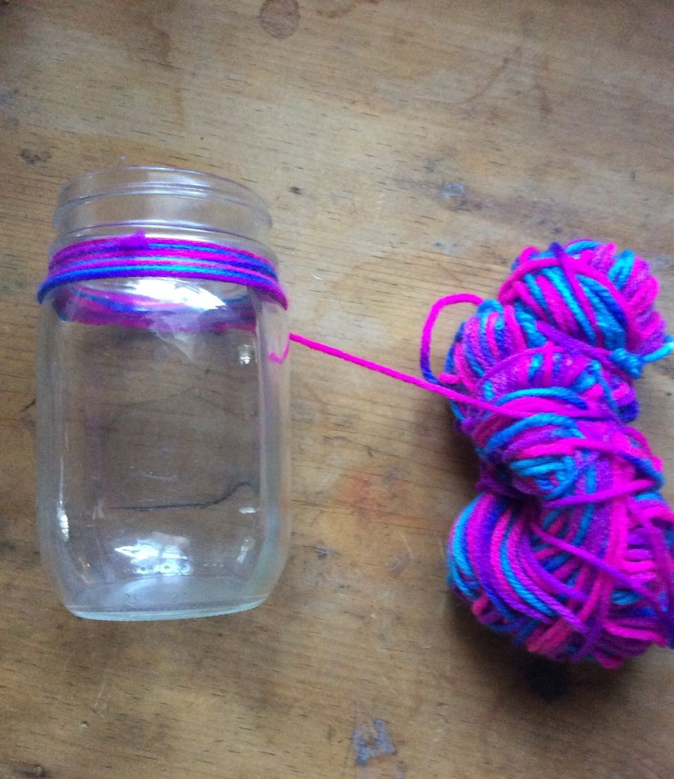 Then start wrapping the yarn around the jar (make sure to wrap it around really tight)
