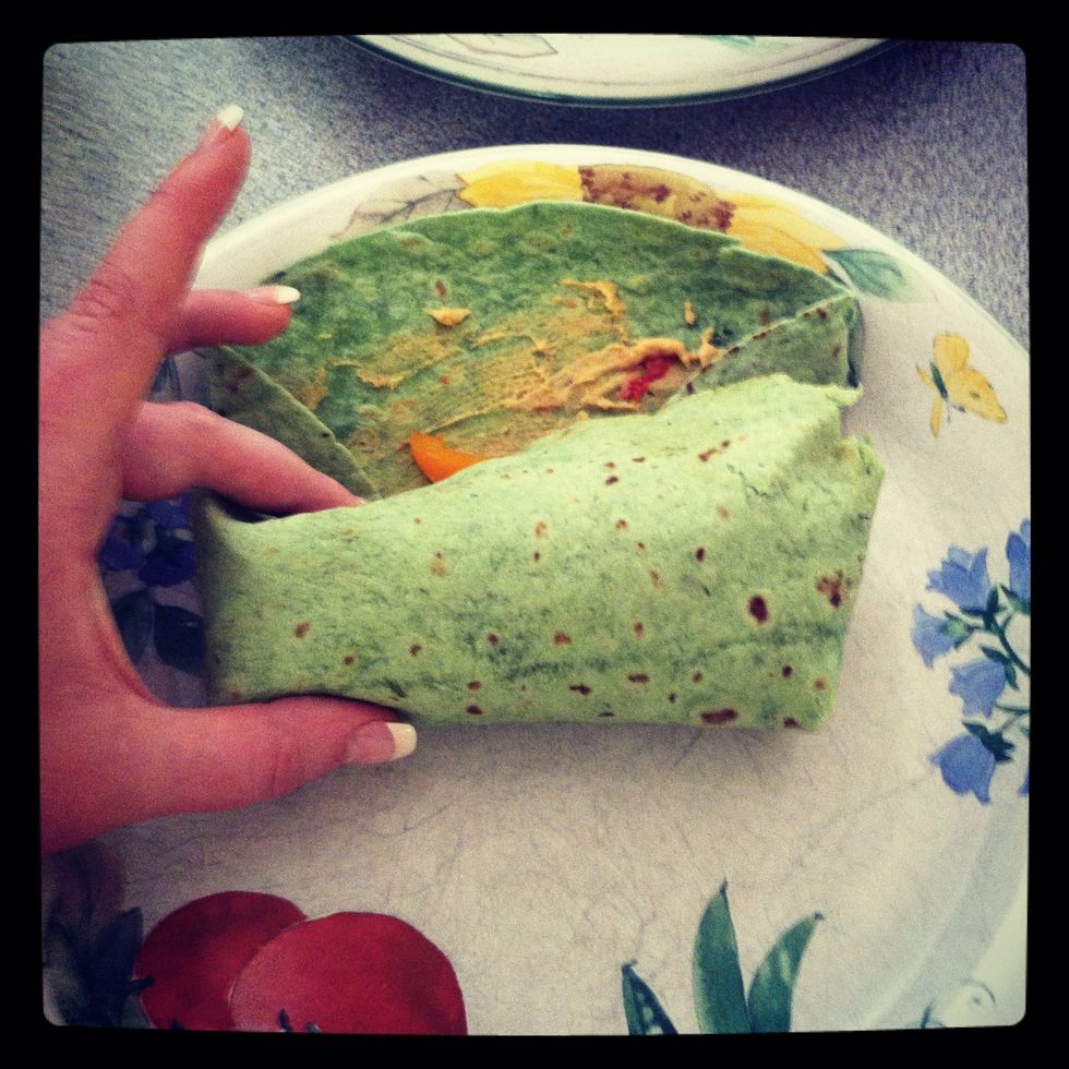 Then starting from the end with the sides folded in begin rolling your wrap up.